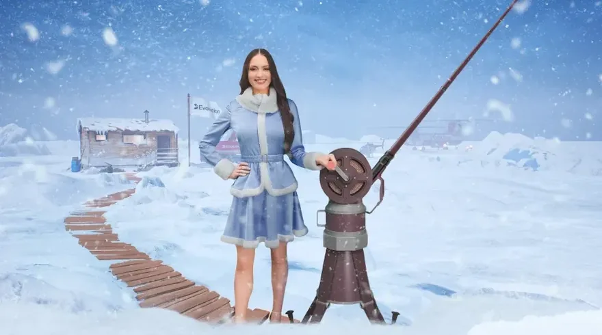 Evolution game host reeling a fish in Ice Fishing